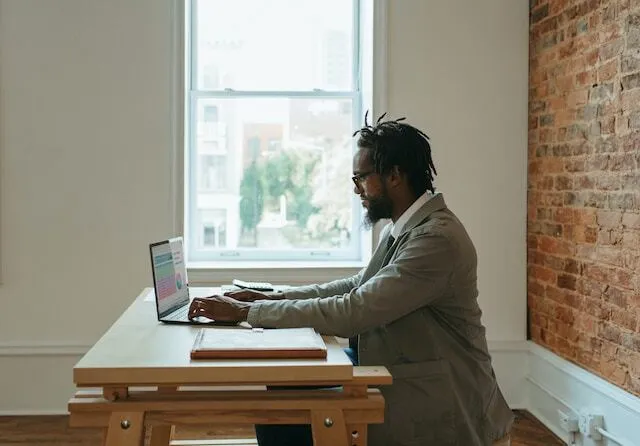 Person using laptop at desk.jpg