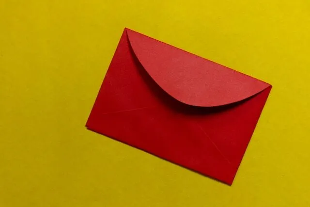 Red envelope on yellow background.jpg