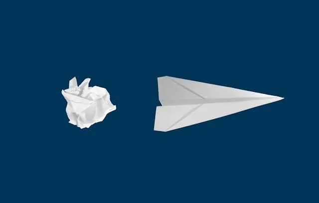 paper airplane on blue background.jpg